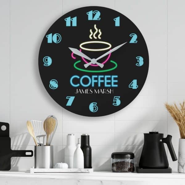 Black Round Clock With Neon-Style Coffee Cup Design And The Name James Marsh.