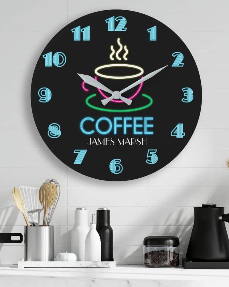Black round clock with neon-style coffee cup design and the name James Marsh.