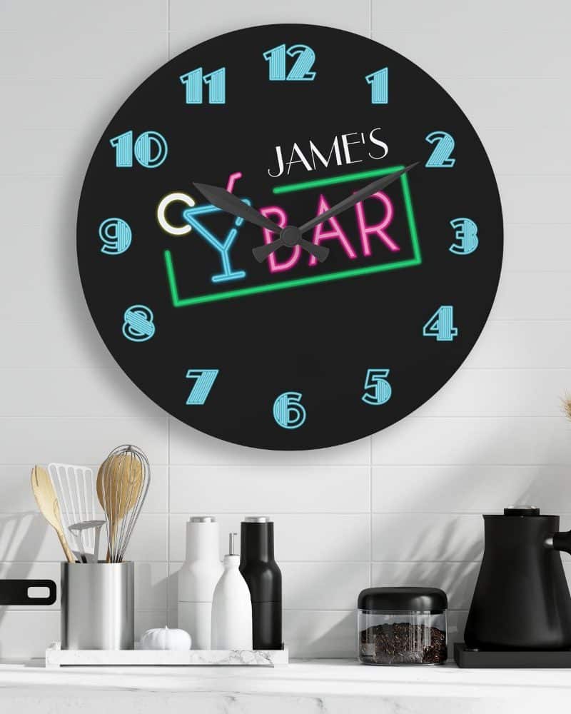 Black round clock with neon-style bar design and James's name.