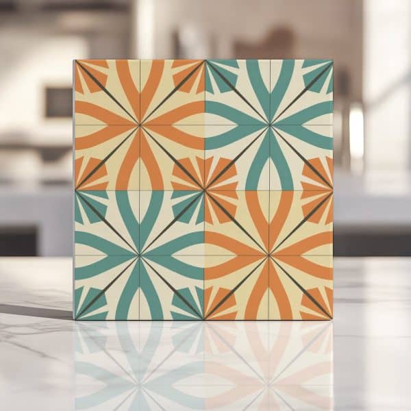Square Tile With A Repeating Geometric Pattern In Teal, Orange, And Beige.
