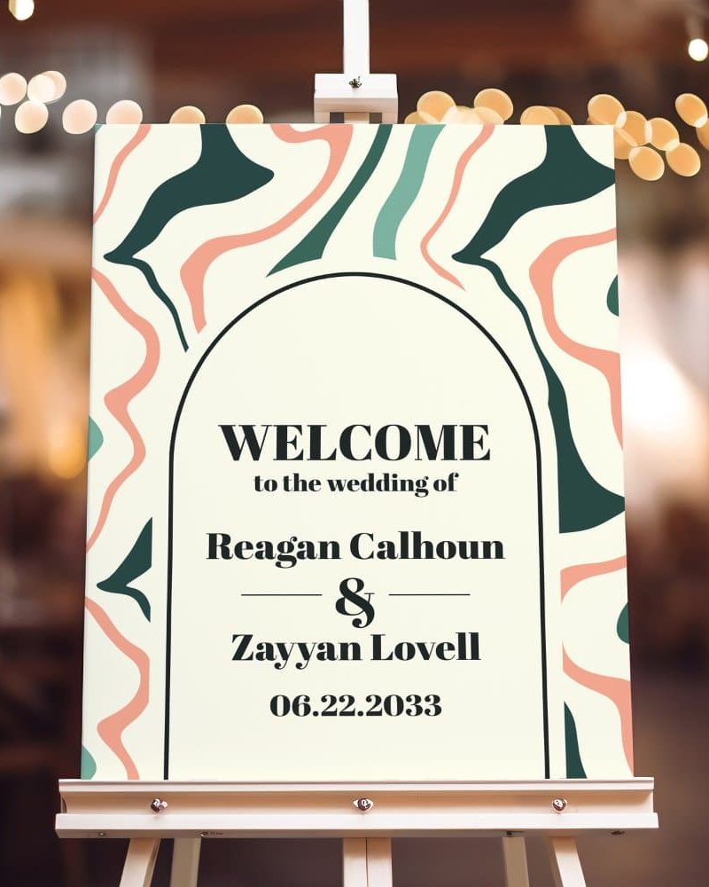 Wedding welcome sign with an abstract design featuring peach, teal, and dark green shapes; it announces the wedding of Reagan Calhoun and Zayyan Lovell on June 22, 2033.
