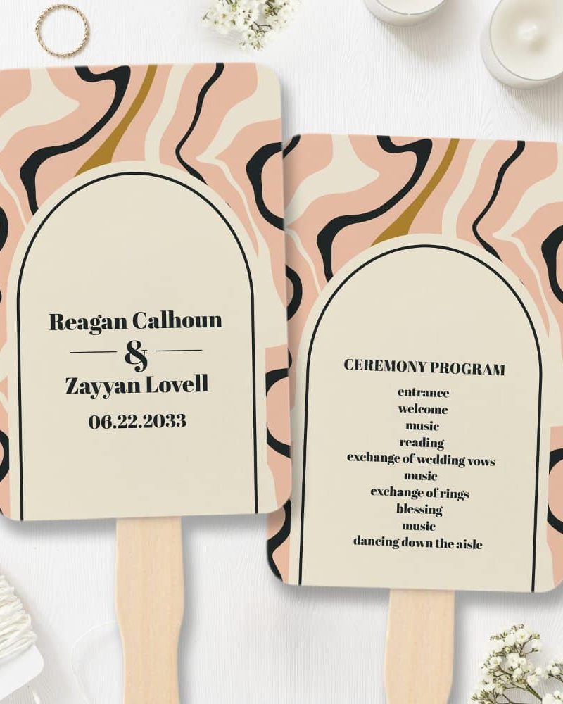Two wedding ceremony program fans with a peach and black abstract design. One fan displays the couple's names and wedding date, the other lists the ceremony events.