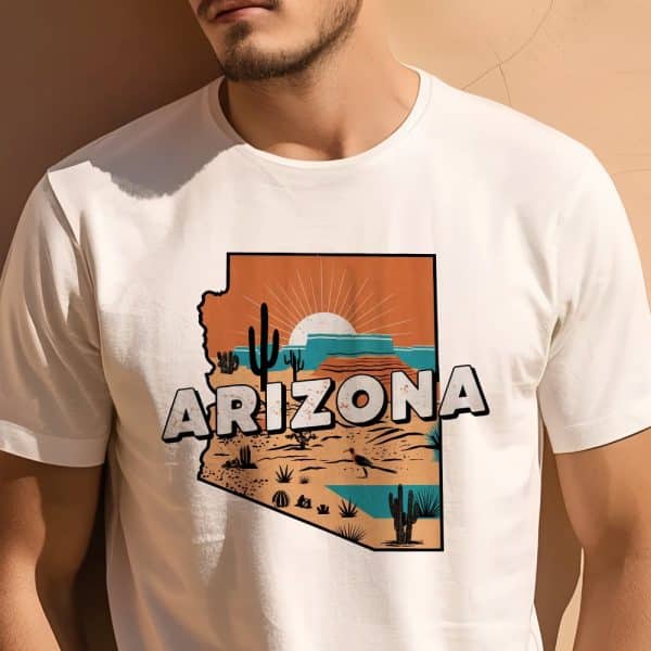 Man Wearing A White T-Shirt Featuring An Arizona-Shaped Graphic With A Desert Landscape And Rising Sun.