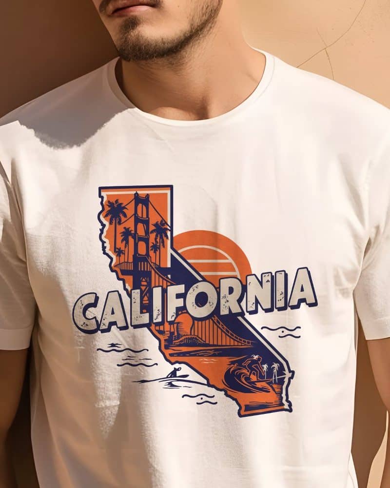 Person wearing a white t-shirt featuring a California graphic with the Golden Gate Bridge, palm trees, and surfers.