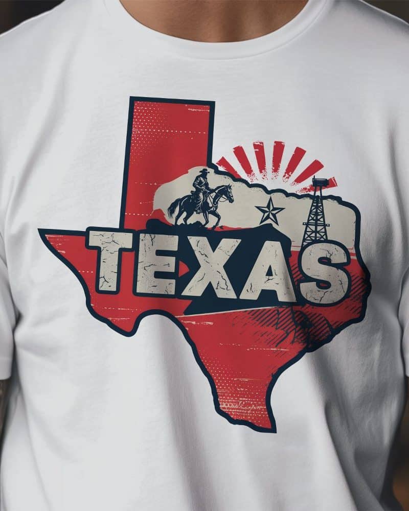 White t-shirt with a vintage-style graphic of the Texas state outline, featuring the word Texas, a cowboy on horseback, and an oil derrick.