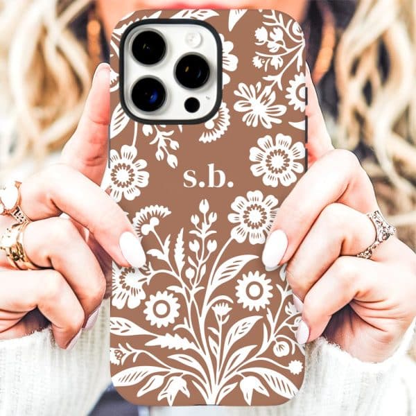 Brown Iphone Case With A White Floral Pattern And Initials S.b.