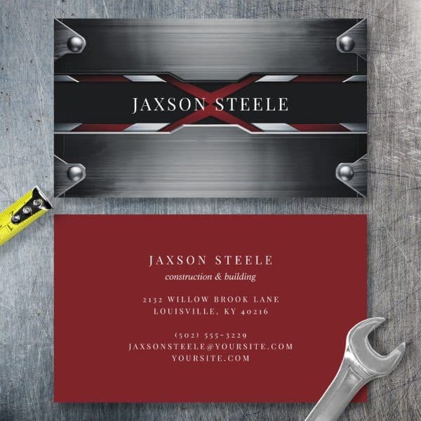 Jaxson Steele Construction And Building Business Card With A Metallic Gray And Red Design.