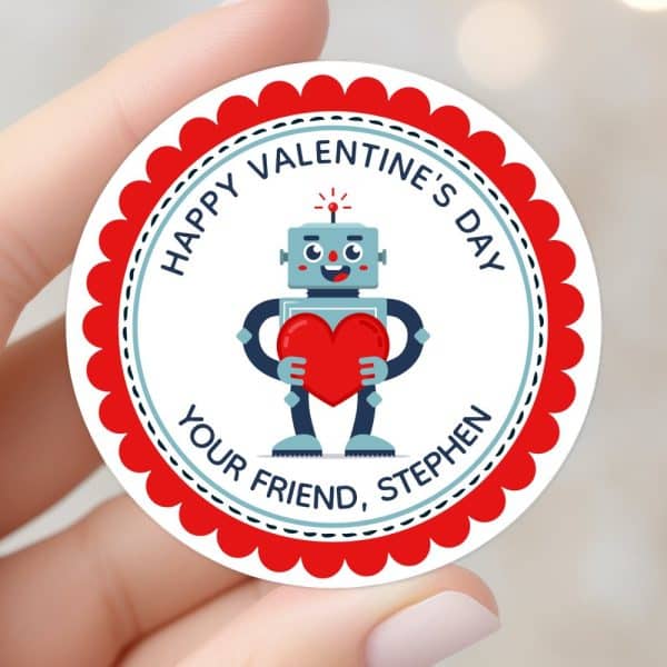 Round Valentine'S Day Sticker Featuring A Robot Holding A Heart.