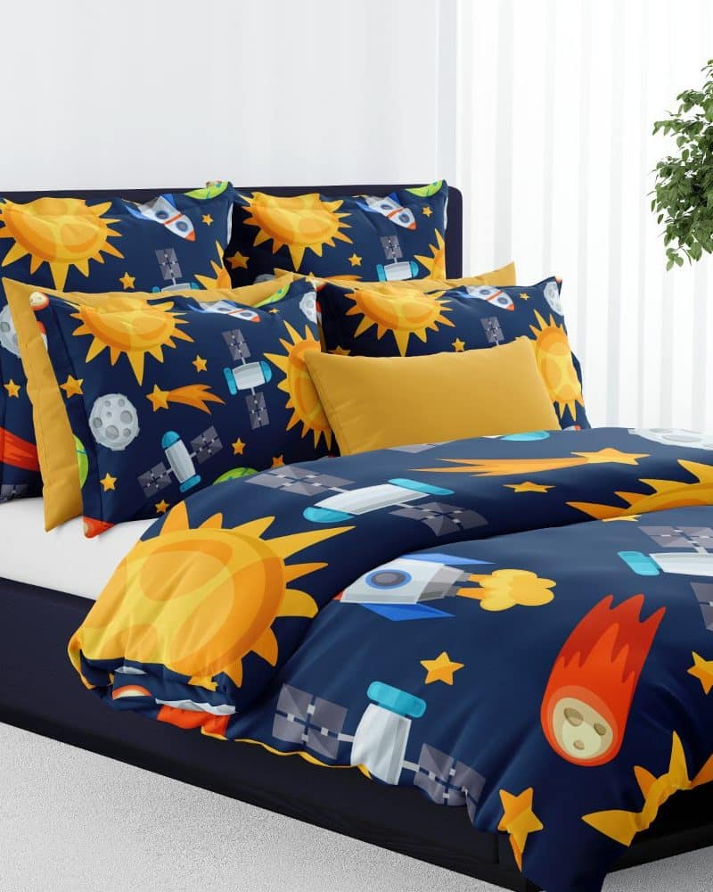 A navy blue duvet cover with a playful space theme featuring suns, rockets, and satellites.
