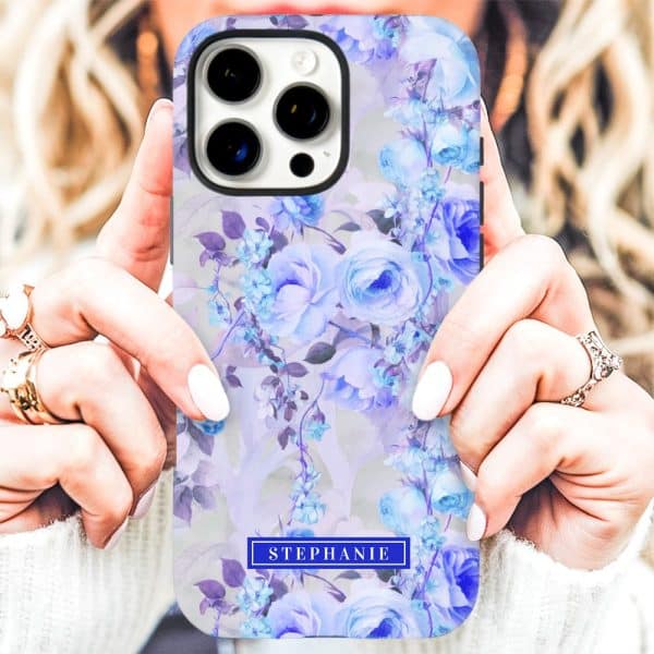 Person Holding A Phone Case With A Pale Purple And Blue Floral Design And The Name Stephanie.
