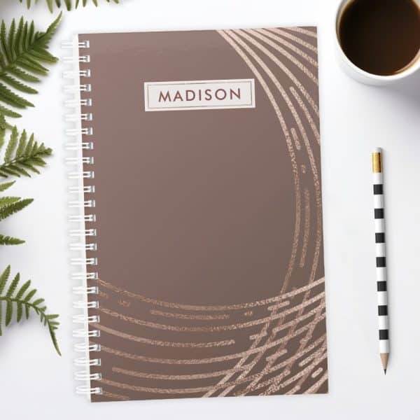 Spiral-Bound Notebook With A Mauve Cover Featuring Rose Gold Abstract Lines And The Name Madison.