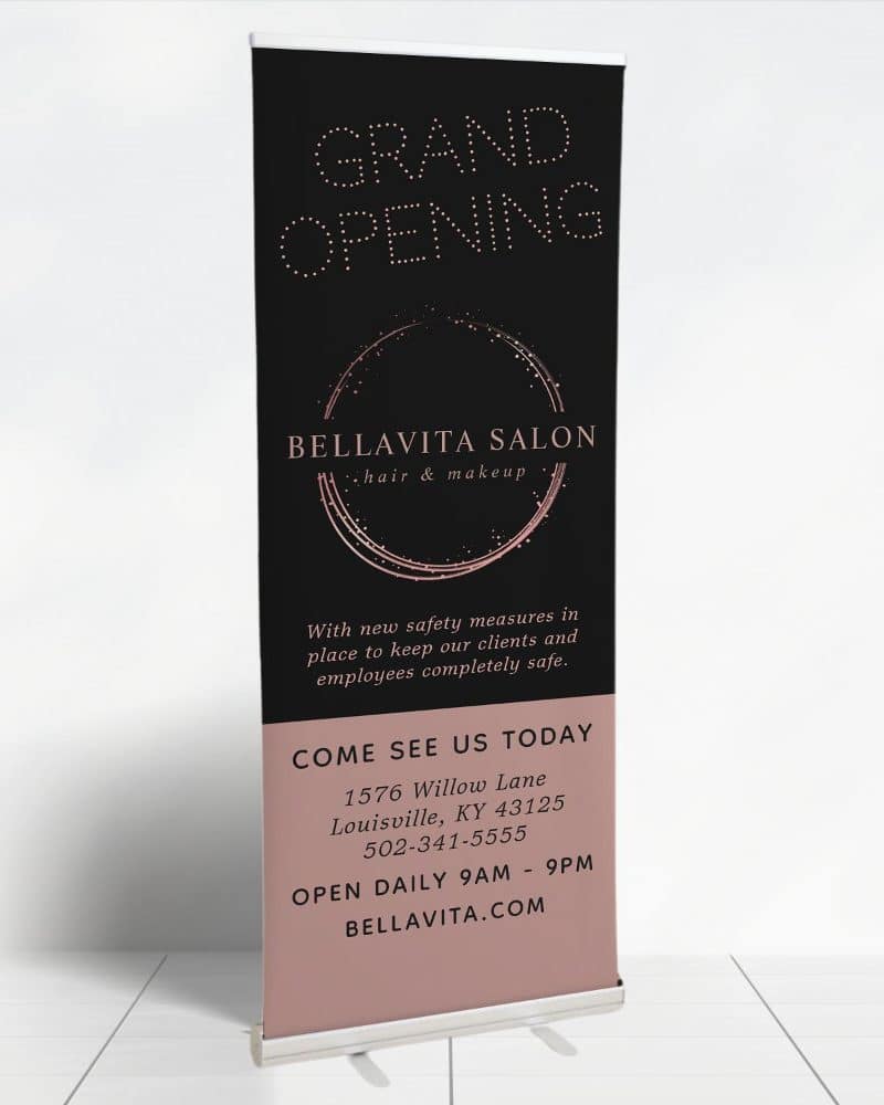 Bellavita Salon grand opening retractable banner announcing hair and makeup services, including address and hours.