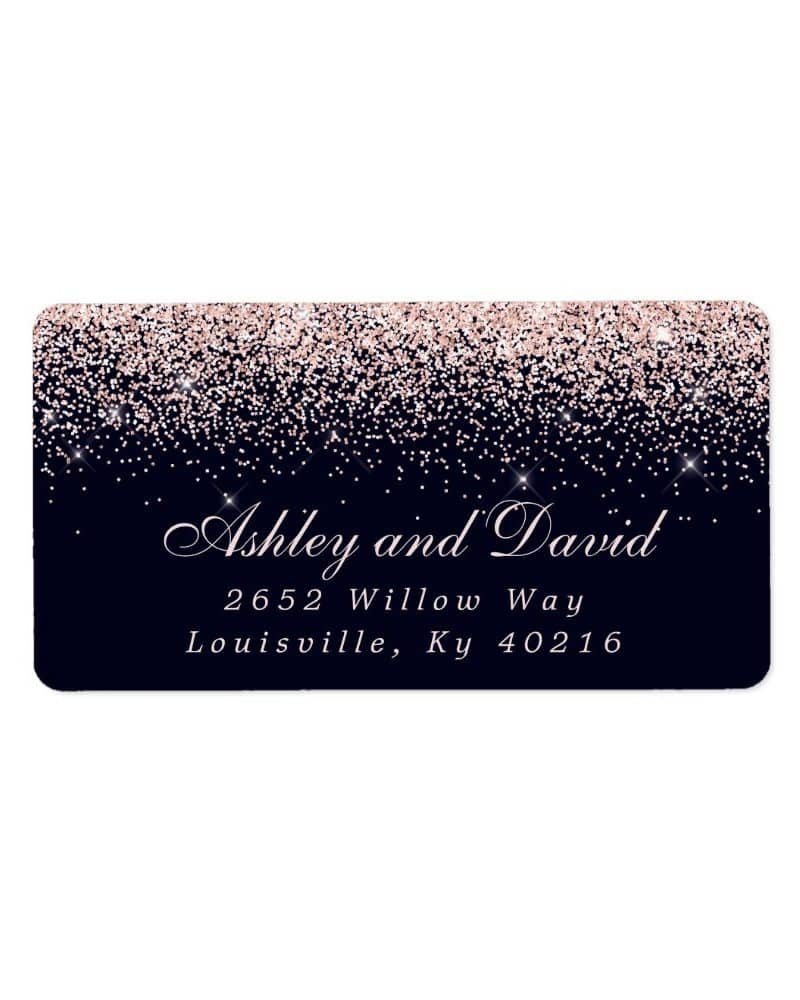 Return address label with rose gold glitter on a navy background, showing Ashley and David's address.