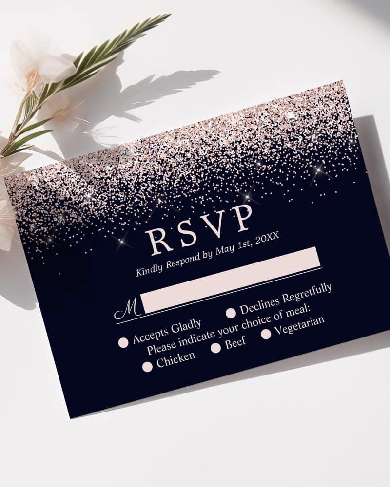 Navy blue RSVP card with rose gold glitter, requesting response by May 1st.