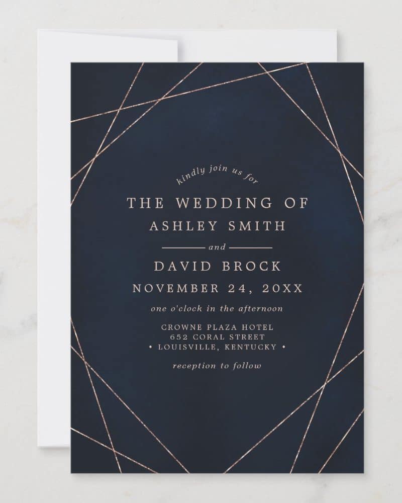 Navy blue wedding invitation with rose gold geometric lines; Ashley Smith and David Brock's wedding details.