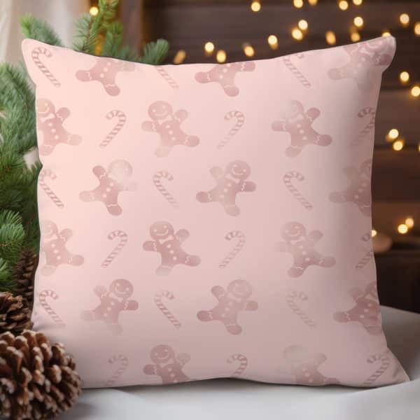 Pink Throw Pillow With A Repeating Pattern Of Rose Gold Gingerbread Men And Candy Canes.
