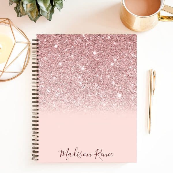 Spiral-Bound Notebook With A Rose Gold Glitter Ombre Design And The Name Madison Renee.