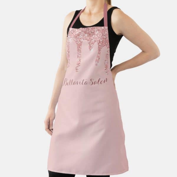 Pink Apron With Rose Gold Glitter Drips And Bella Vita Salon Text.