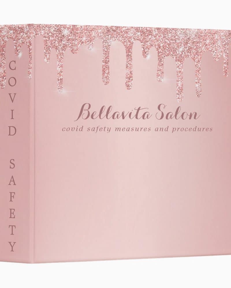 Pink binder displaying Bellavita Salon Covid safety measures and procedures. Rose gold glitter drips across the top.