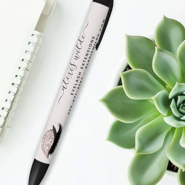 A Pen With Alexis Wilde'S Name And Eyelash Extensions Business Information Printed On It.
