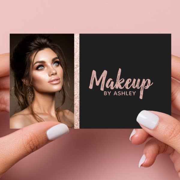 A Black And Rose Gold Business Card For Makeup By Ashley, Featuring A Photo Of A Woman With Professional Makeup.