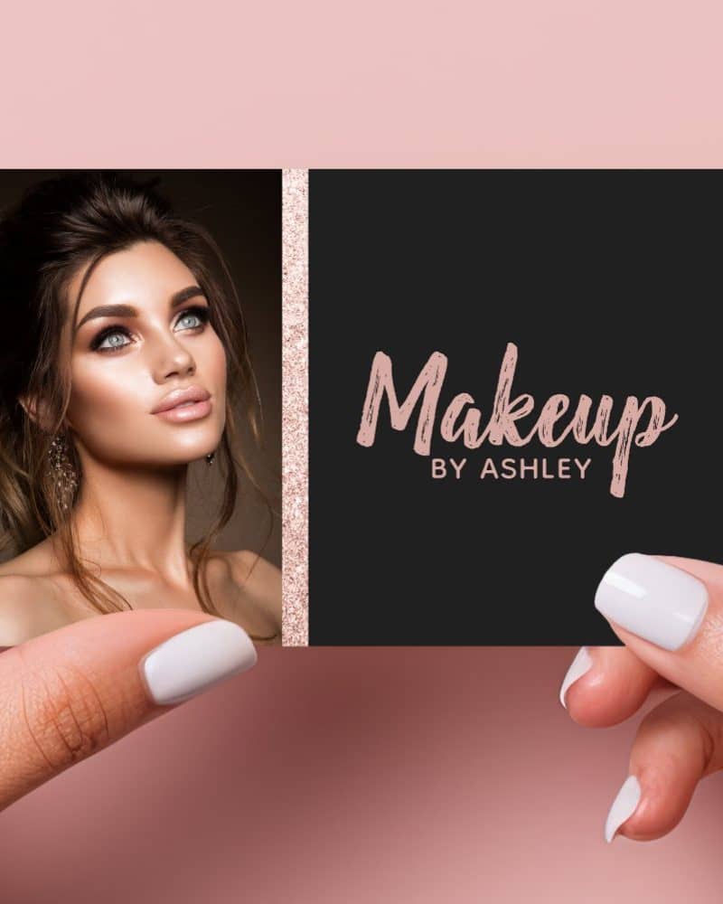 A black and rose gold business card for Makeup by Ashley, featuring a photo of a woman with professional makeup.