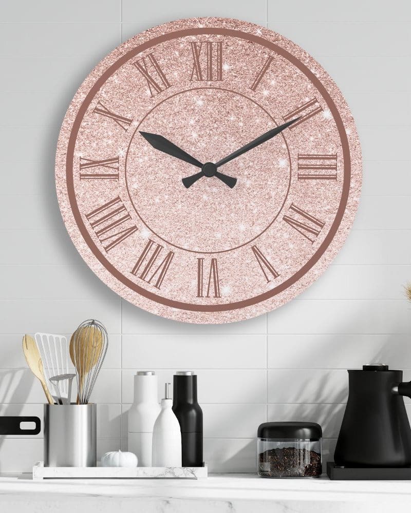 Rose gold glitter clock with roman numerals.