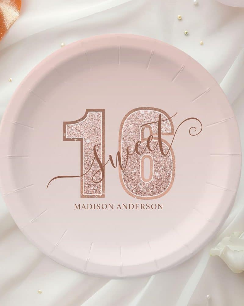 Pink paper plate with rose gold glitter sixteen and Sweet 16 design, personalized with Madison Anderson.