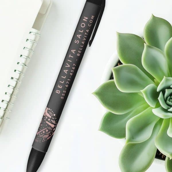 Black Pen With Bella Vita Salon Contact Information And A Small Rose Gold Design.