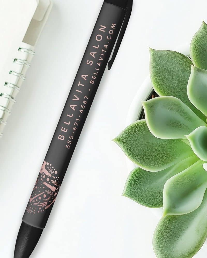 Black pen with Bella Vita Salon contact information and a small rose gold design.