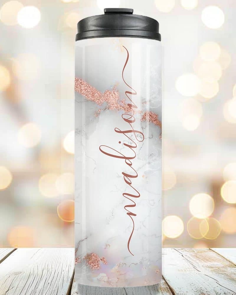 Personalized travel tumbler with marble design and rose gold name Madison.