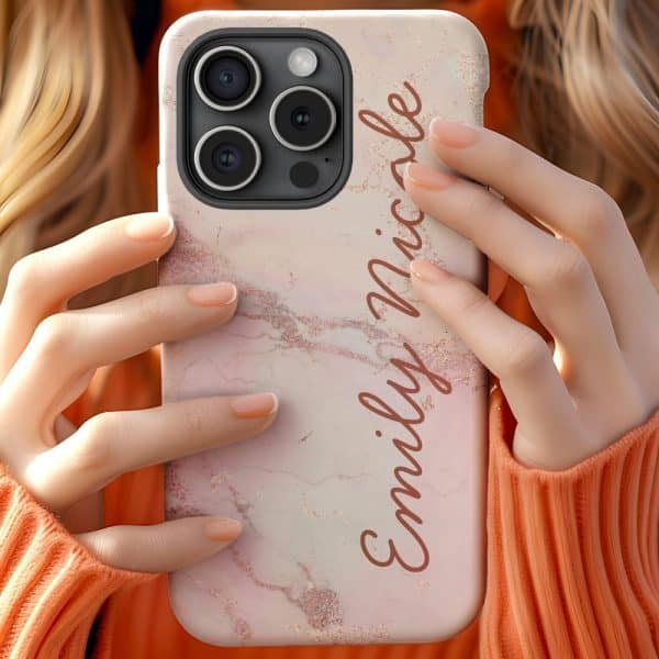 Person Holding A Pink Marble Iphone Case With The Name Emily Nicole Written On It.