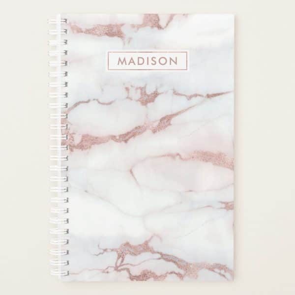 Rose Gold Marble Spiral Notebook With The Name Madison On The Cover.