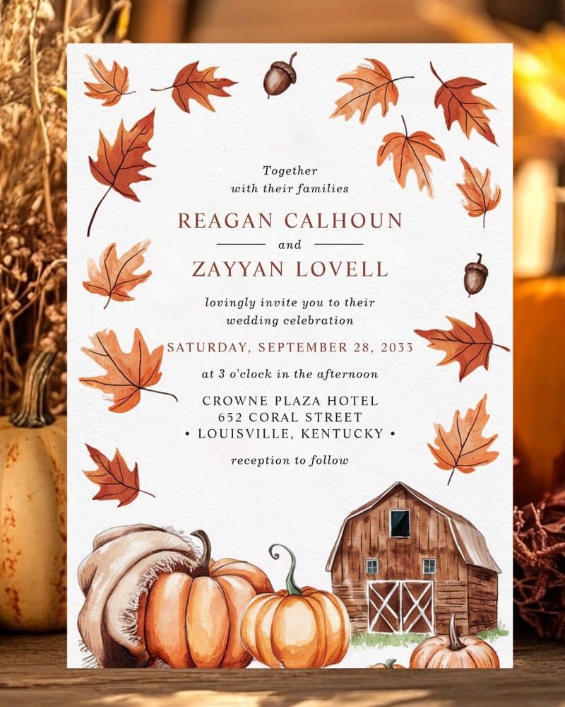 Fall-themed wedding invitation for Reagan Calhoun and Zayyan Lovell, featuring pumpkins and a barn.