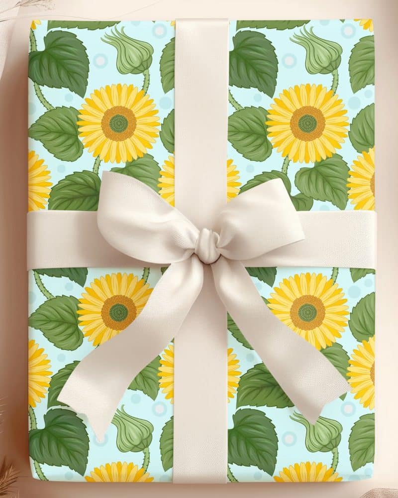 Gift wrapped in sunflower patterned paper with a cream-colored ribbon.