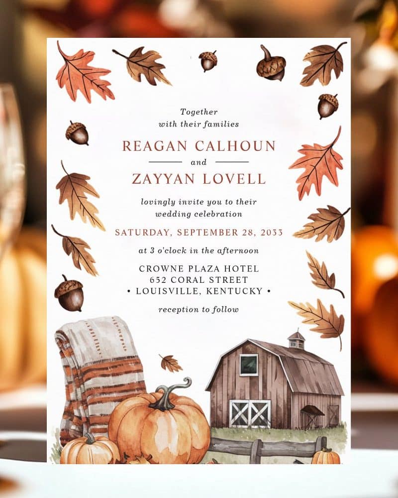 Fall-themed wedding invitation with pumpkins, a barn, and autumn leaves. Reagan Calhoun and Zayyan Lovell's wedding details are featured.
