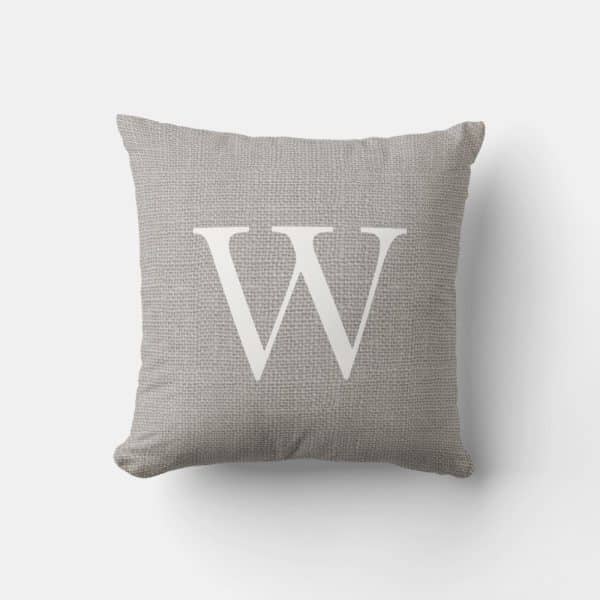 Gray Throw Pillow With A White Capital W.
