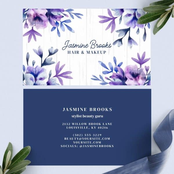 Business Card For Jasmine Brooks, Hair And Makeup Stylist, Featuring Watercolor Purple Flowers.