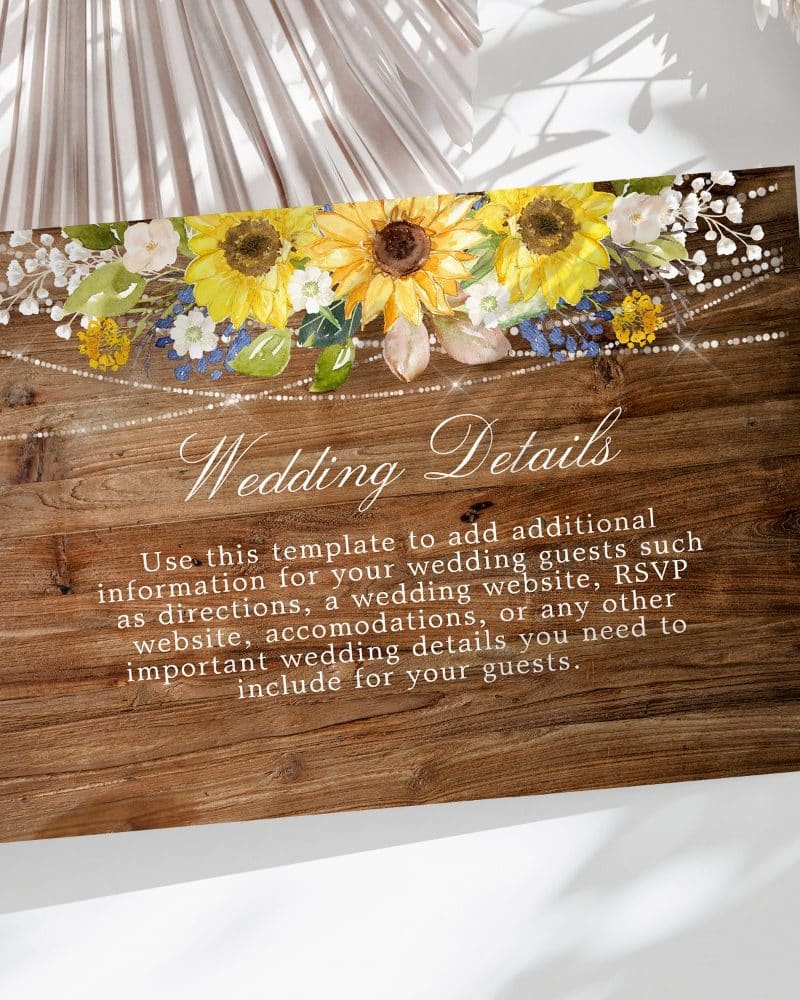Wedding details card with sunflowers and string lights on a wood background.