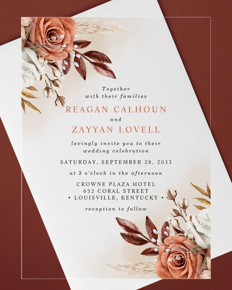 Wedding invitation with autumnal floral border featuring roses and pampas grass.