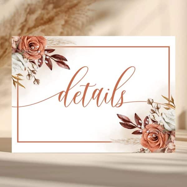 White Details Sign With Terracotta Floral Corners And The Word Details In A Script Font.