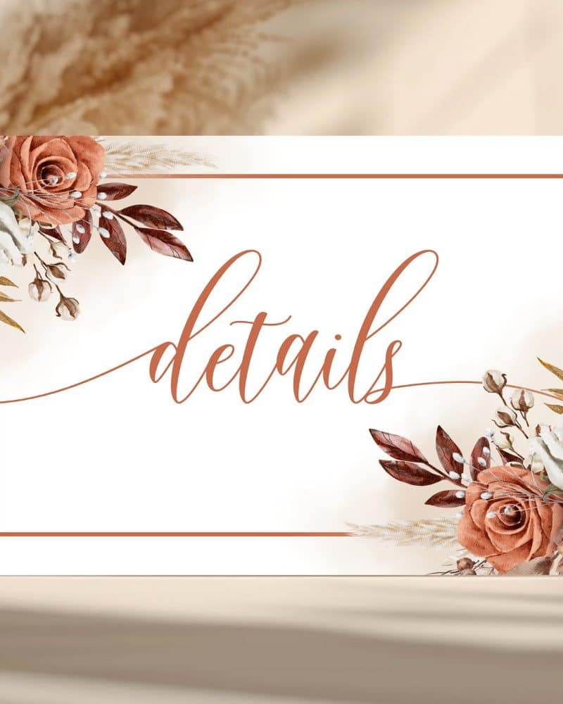 White details sign with terracotta floral corners and the word details in a script font.