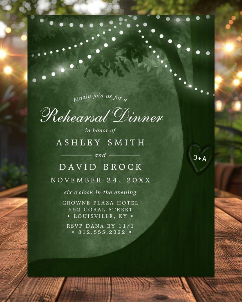 Dark green rehearsal dinner invitation featuring a tree silhouette with string lights, announcing Ashley Smith and David Brock's November 24th celebration.
