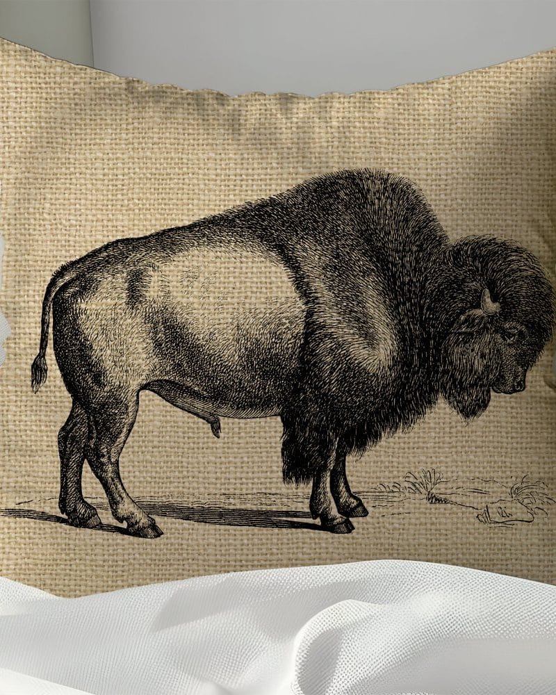 Burlap pillow featuring a black and white illustration of a bison.