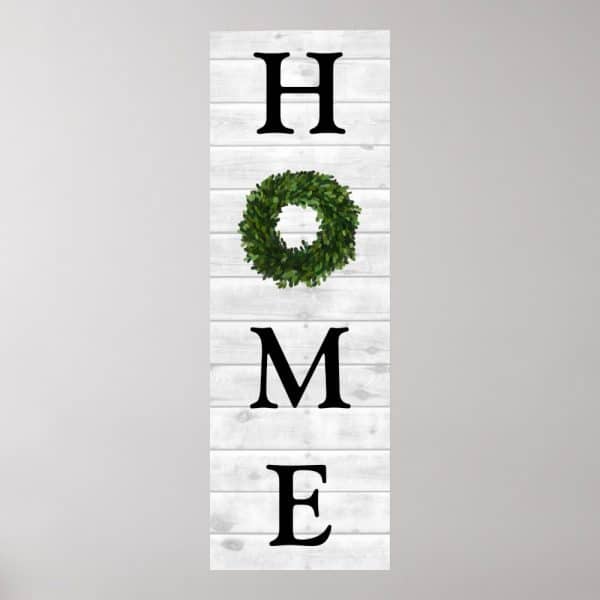 Vertical Sign With The Word Home, O Replaced By A Green Wreath.