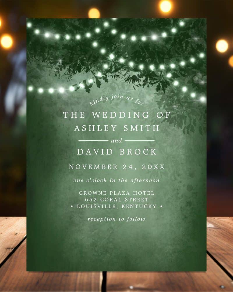Dark green wedding invitation with string lights and leaves; Ashley Smith and David Brock's wedding details.