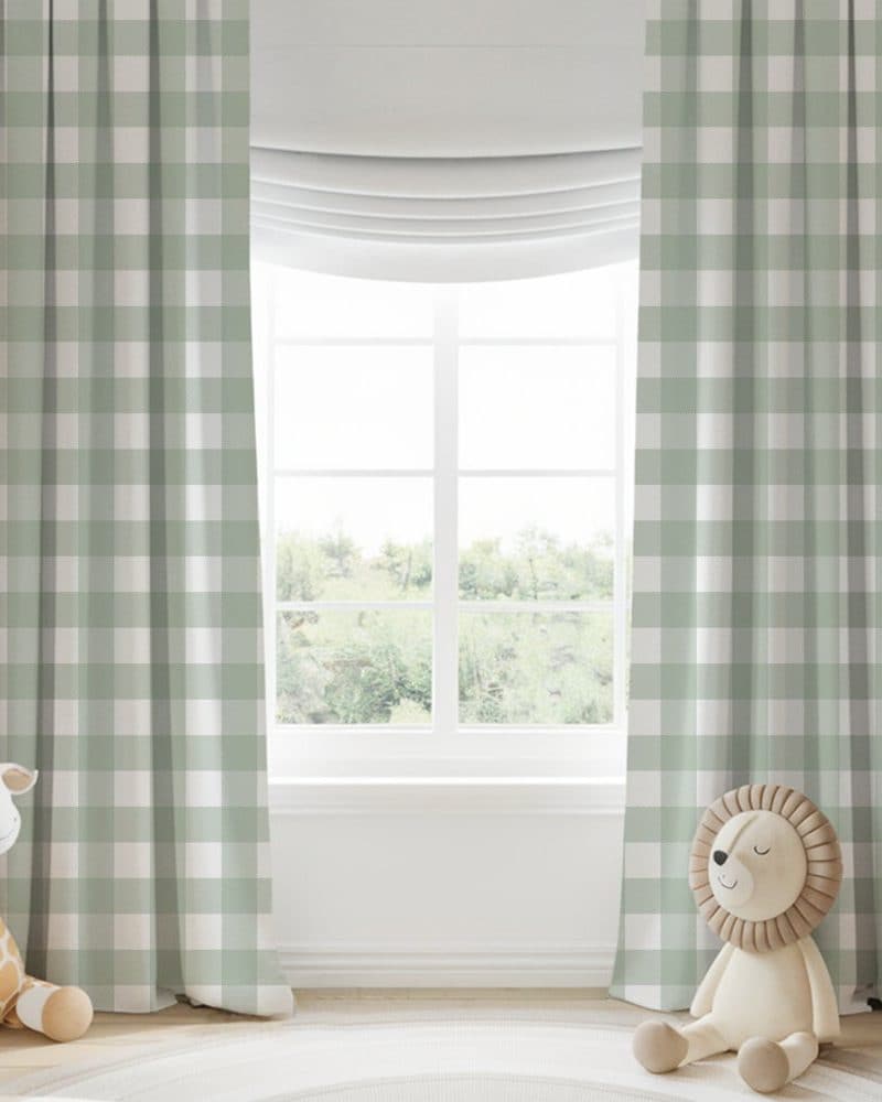 Sage green gingham curtains flanking a window.