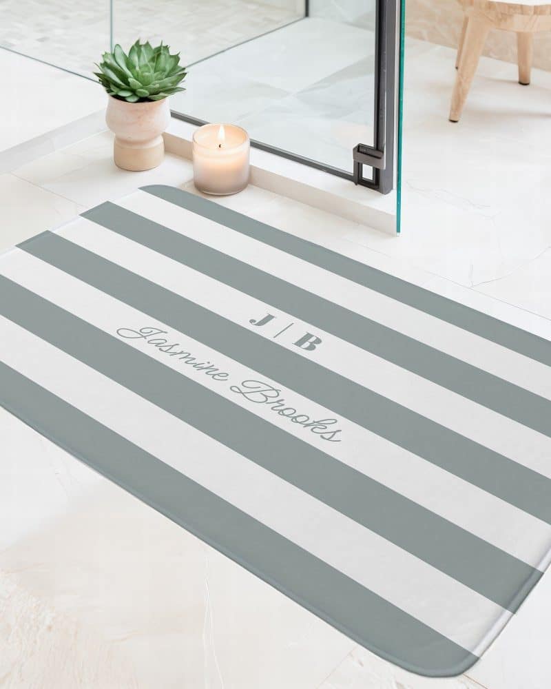 Personalized gray and white striped bath mat with the initials J|B and the name Jasmine Brooks.