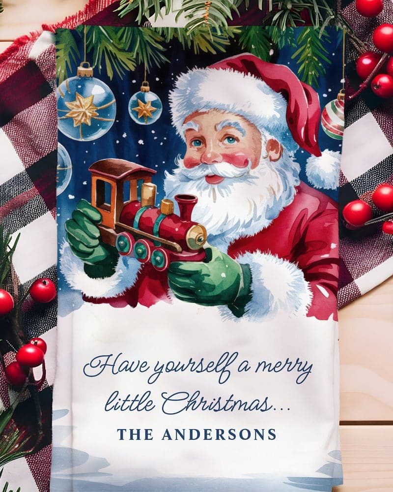 Santa Claus holding a toy train.