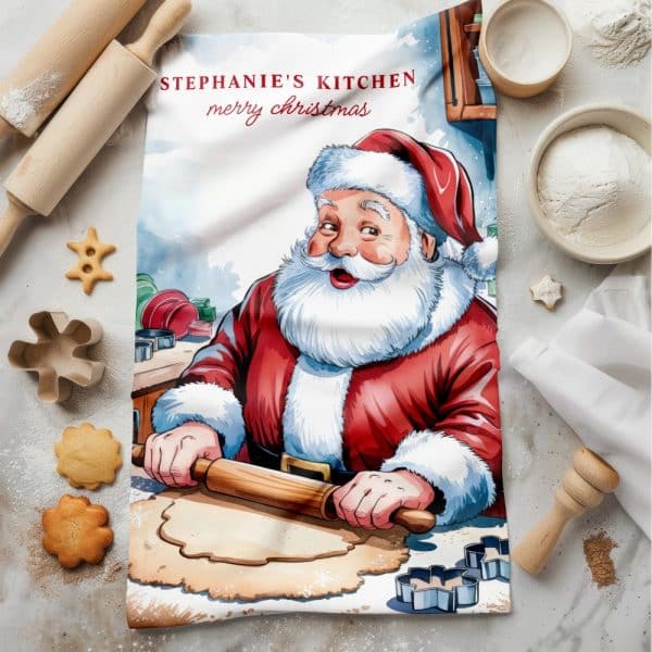 Kitchen Tea Towel Featuring Santa Claus Baking Christmas Cookies.